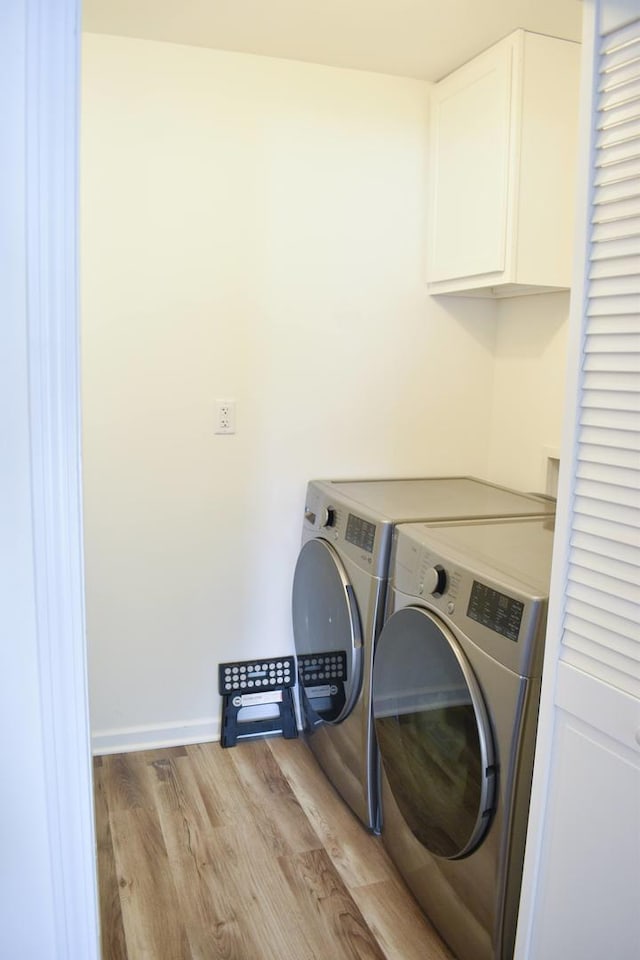 631 Central Ave, Joliet, IL 60436 - laundry room featuring cabinet space, washing machine and clothes dryer, and wood finished floors
