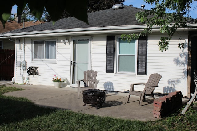 631 Central Ave, Joliet, IL 60436 - rear view of house featuring a patio and an outdoor fire pit