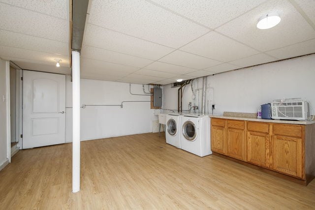 1S215 Stratford Ln, Villa Park, IL 60181 - laundry room with washing machine and dryer, cabinet space, light wood-style floors, and electric panel