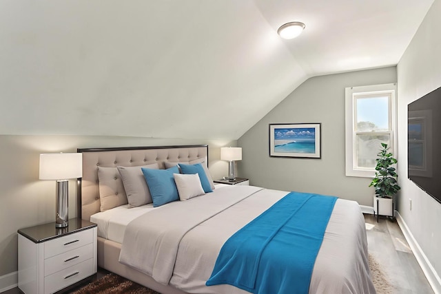 9720 S Exchange Ave, Chicago, IL 60617 - bedroom with vaulted ceiling and dark wood-type flooring