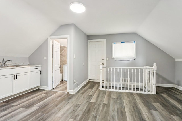 9720 S Exchange Ave, Chicago, IL 60617 - additional living space featuring lofted ceiling and wood finished floors