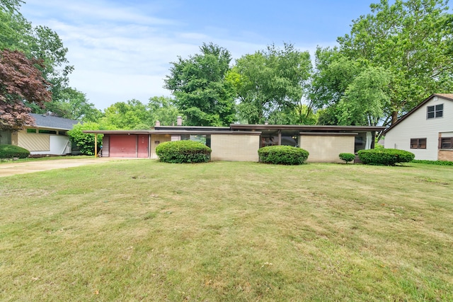 330 S Rosedale Ave, Aurora, IL 60506 - view of front of house with driveway, a front lawn, and a chimney