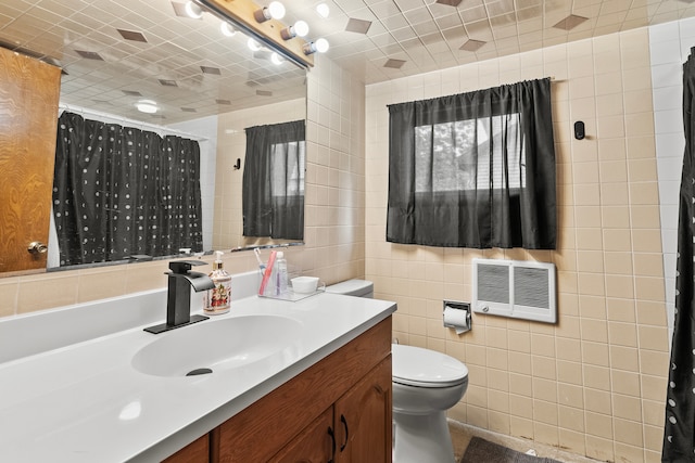 330 S Rosedale Ave, Aurora, IL 60506 - full bath with tile walls, vanity, curtained shower, and heating unit