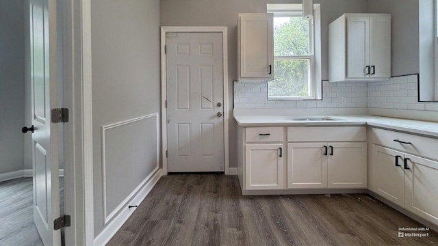5738 S Carpenter St, Chicago, IL 60621 - kitchen featuring dark wood-style floors, tasteful backsplash, white cabinetry, and light countertops