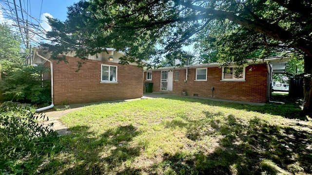 15043 Meadow Ln, Dolton, IL 60419 - rear view of house with brick siding and a yard