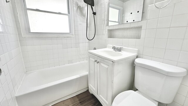 15043 Meadow Ln, Dolton, IL 60419 - full bath with tile walls, vanity, shower / washtub combination, and wood finished floors