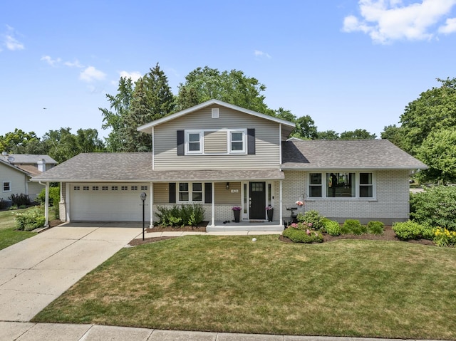 1426 E Kenilworth Ave, Palatine, IL 60074 - view of front facade with a garage, brick siding, a front lawn, concrete driveway, and covered porch
