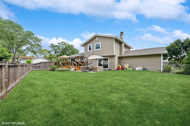 1426 E Kenilworth Ave, Palatine, IL 60074 - rear view of property featuring a fenced backyard, a chimney, a deck, and an outdoor living space