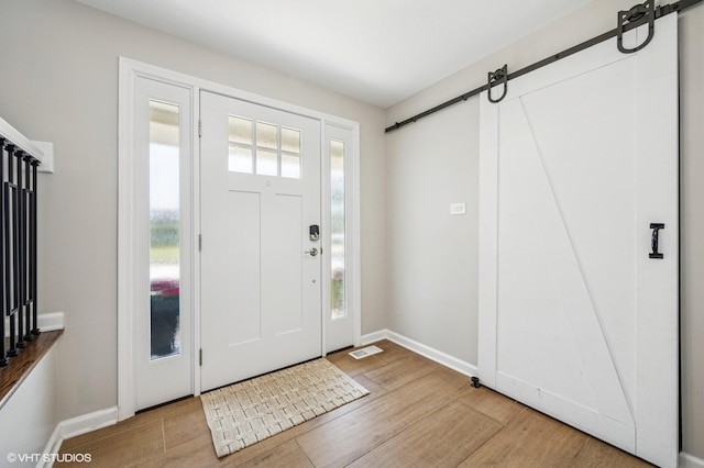 1426 E Kenilworth Ave, Palatine, IL 60074 - foyer entrance featuring a barn door and wood finished floors