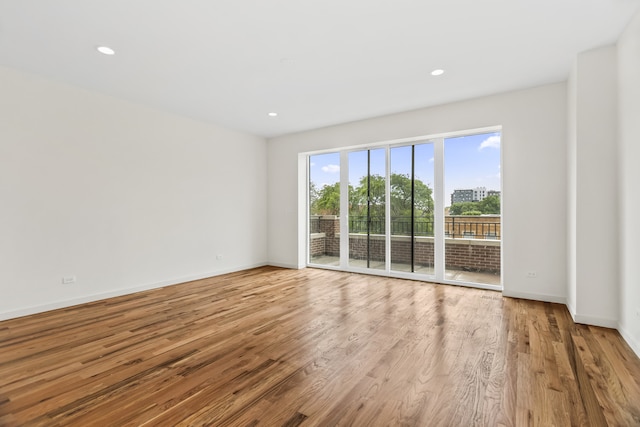 4316 S Michigan Ave Unit 1S, Chicago, IL 60653 - unfurnished room featuring wood finished floors and recessed lighting