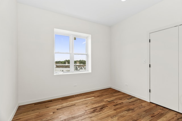 4316 S Michigan Ave Unit 1S, Chicago, IL 60653 - spare room featuring wood finished floors and baseboards