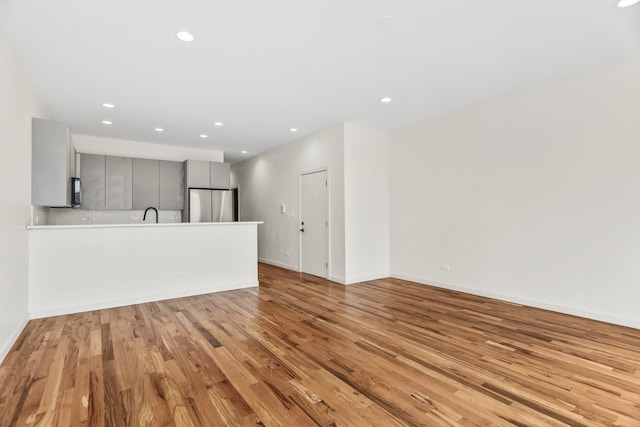 4316 S Michigan Ave Unit 1S, Chicago, IL 60653 - unfurnished living room with light wood-style floors and recessed lighting