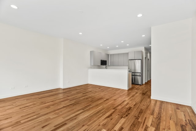 4316 S Michigan Ave Unit 1S, Chicago, IL 60653 - unfurnished living room featuring light wood finished floors and recessed lighting