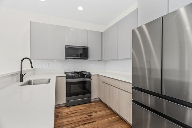 4316 S Michigan Ave Unit 1S, Chicago, IL 60653 - kitchen with appliances with stainless steel finishes, modern cabinets, light countertops, tasteful backsplash, and recessed lighting
