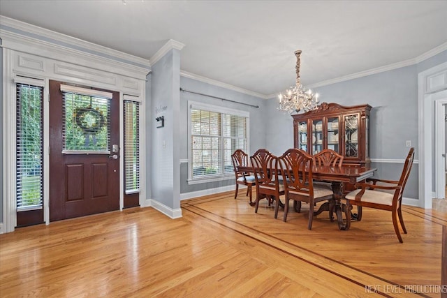 1108 Independence Ave, Elburn, IL 60119 - dining space featuring a chandelier, light wood-type flooring, and ornamental molding