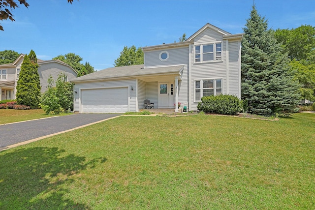710 Cimarron Dr, Cary, IL 60013 - traditional-style house with driveway, a garage, and a front yard