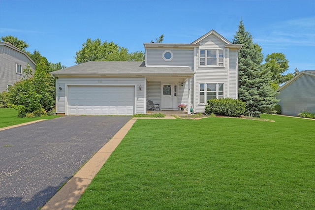 710 Cimarron Dr, Cary, IL 60013 - traditional-style house featuring a garage, a front lawn, and driveway