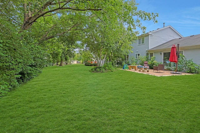 710 Cimarron Dr, Cary, IL 60013 - view of grassy yard featuring a patio