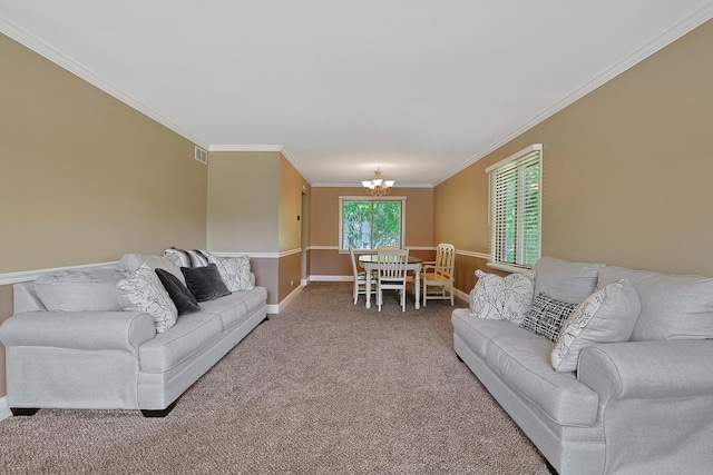 710 Cimarron Dr, Cary, IL 60013 - living area with carpet flooring, ornamental molding, and a chandelier