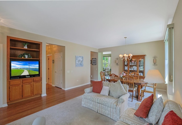 12856 W Rocksprings Ln, Huntley, IL 60142 - living room featuring a chandelier, wood finished floors, and carpet floors