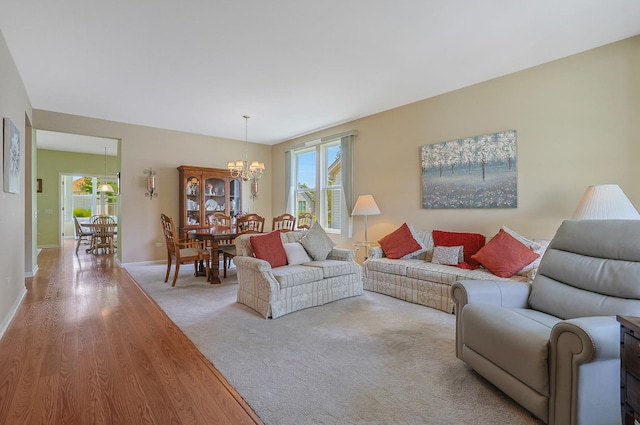 12856 W Rocksprings Ln, Huntley, IL 60142 - living area with a chandelier, healthy amount of natural light, and wood finished floors