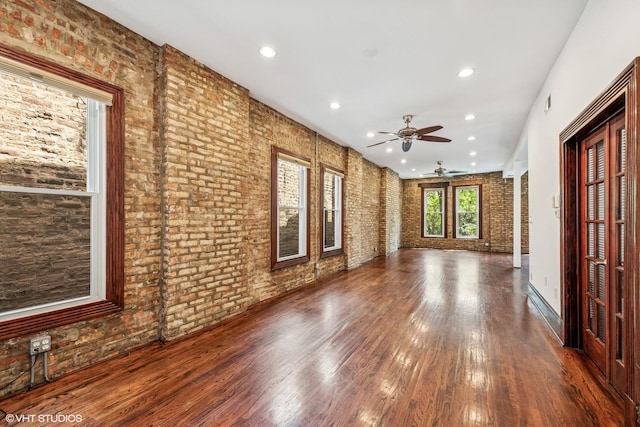 1734 W Erie St Unit 3, Chicago, IL 60622 - unfurnished living room featuring brick wall, ceiling fan, wood finished floors, and recessed lighting