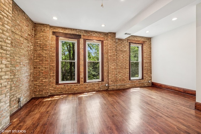 1734 W Erie St Unit 3, Chicago, IL 60622 - unfurnished room featuring healthy amount of natural light, wood finished floors, brick wall, and recessed lighting