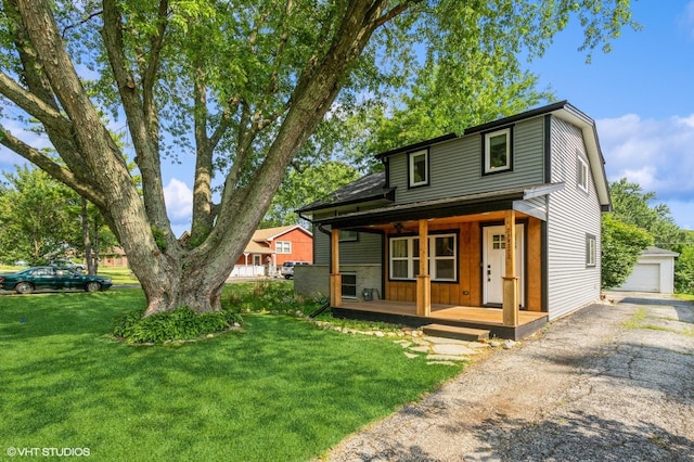 26W323 Harrison Ave, Winfield, IL 60190 - view of front of property featuring covered porch, a front yard, and an outbuilding