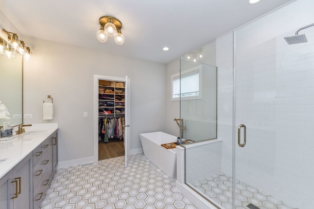 0N337 Herrick Dr, Wheaton, IL 60187 - bathroom featuring a shower stall, double vanity, a freestanding tub, a walk in closet, and tile patterned floors