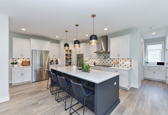 0N337 Herrick Dr, Wheaton, IL 60187 - kitchen featuring stainless steel appliances, wall chimney exhaust hood, backsplash, light wood-style floors, and recessed lighting