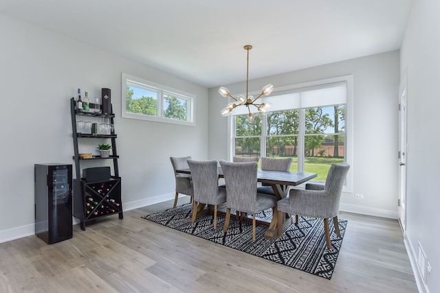 0N337 Herrick Dr, Wheaton, IL 60187 - dining room with a chandelier and light wood-style flooring
