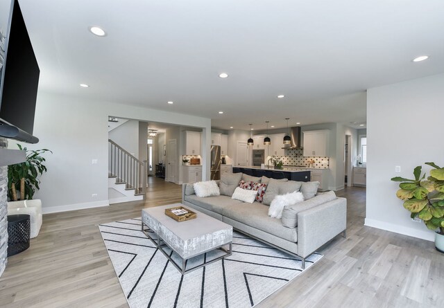 0N337 Herrick Dr, Wheaton, IL 60187 - living area with stairs, light wood-style flooring, and recessed lighting