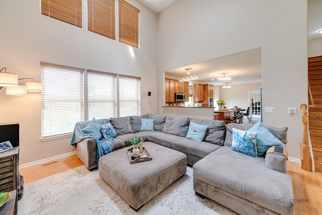 1174 Pine Tree Ct, Lake Villa, IL 60046 - living room with light wood-style flooring and a high ceiling