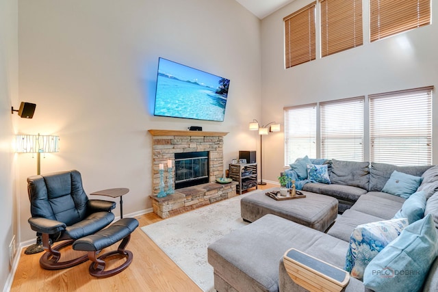 1174 Pine Tree Ct, Lake Villa, IL 60046 - living room featuring a high ceiling, wood finished floors, and a fireplace