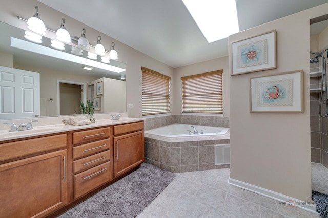 1174 Pine Tree Ct, Lake Villa, IL 60046 - full bath with tile patterned floors, double vanity, a garden tub, a skylight, and tiled shower