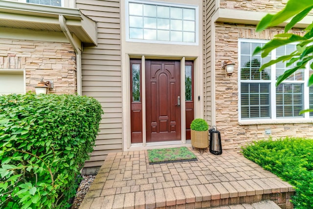 1174 Pine Tree Ct, Lake Villa, IL 60046 - doorway to property featuring stone siding