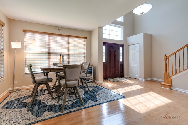 1174 Pine Tree Ct, Lake Villa, IL 60046 - foyer with stairs, wood finished floors, and a high ceiling