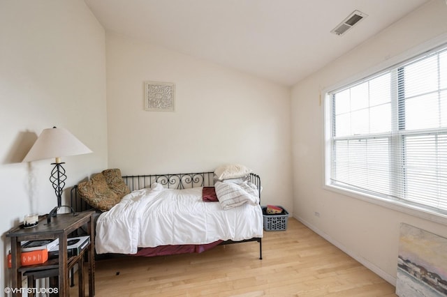 573 W Parkside Dr, Palatine, IL 60067 - bedroom with light wood-style flooring, multiple windows, and lofted ceiling