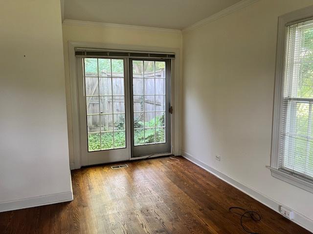 1917 Thornhill Rd, Inverness, IL 60067 - unfurnished room with healthy amount of natural light, crown molding, and wood finished floors
