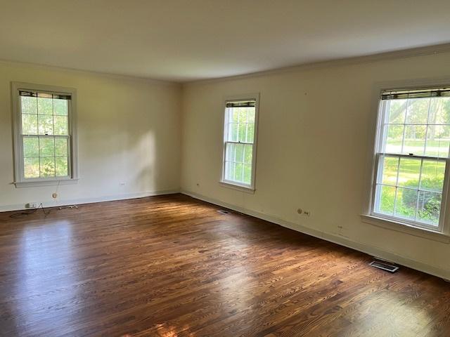 1917 Thornhill Rd, Inverness, IL 60067 - unfurnished room with plenty of natural light, ornamental molding, and wood finished floors
