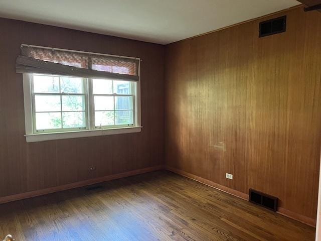 1917 Thornhill Rd, Inverness, IL 60067 - unfurnished room featuring wood finished floors and wood walls