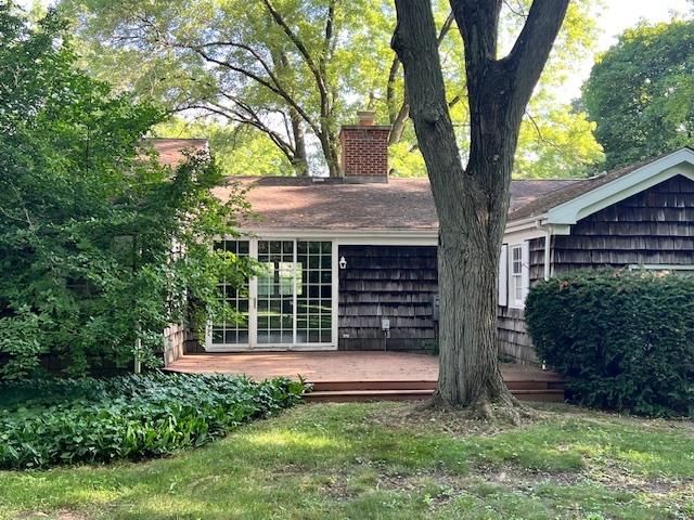 1917 Thornhill Rd, Inverness, IL 60067 - view of home's exterior featuring a chimney and a wooden deck