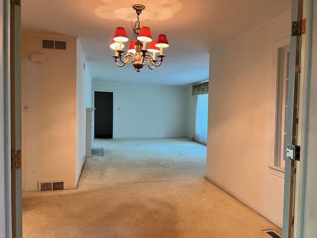 1917 Thornhill Rd, Inverness, IL 60067 - corridor featuring carpet flooring and a chandelier