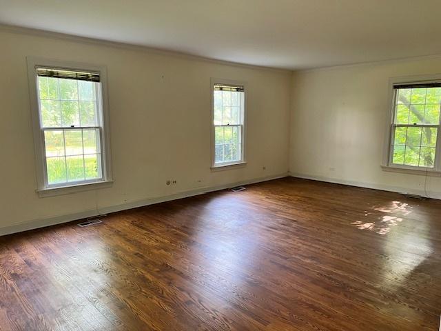 1917 Thornhill Rd, Inverness, IL 60067 - unfurnished room with plenty of natural light, crown molding, and wood finished floors