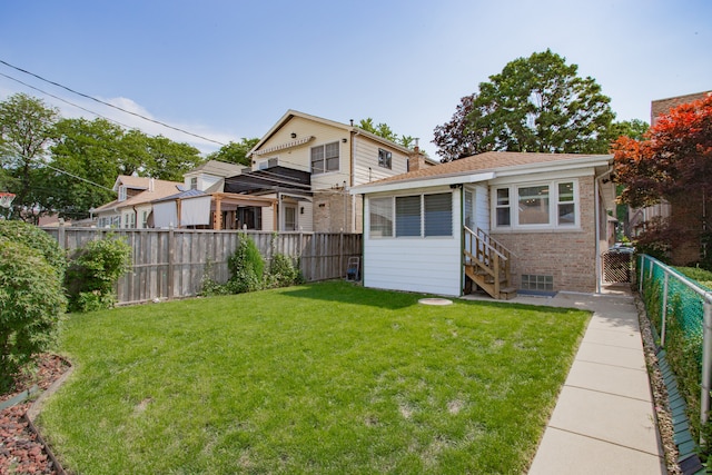 5246 N Mason Ave, Chicago, IL 60630 - back of house with brick siding and a fenced backyard