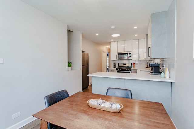5246 N Mason Ave, Chicago, IL 60630 - dining room with recessed lighting and wood finished floors