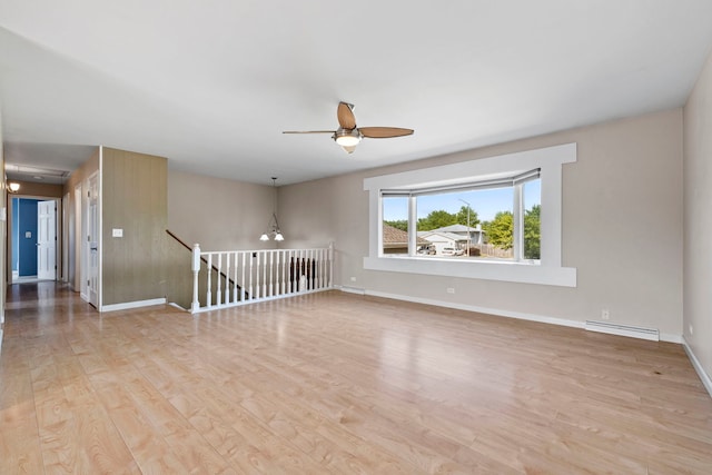 913 S Bentley Rd, New Lenox, IL 60451 - unfurnished room with a ceiling fan, light wood-type flooring, and baseboard heating