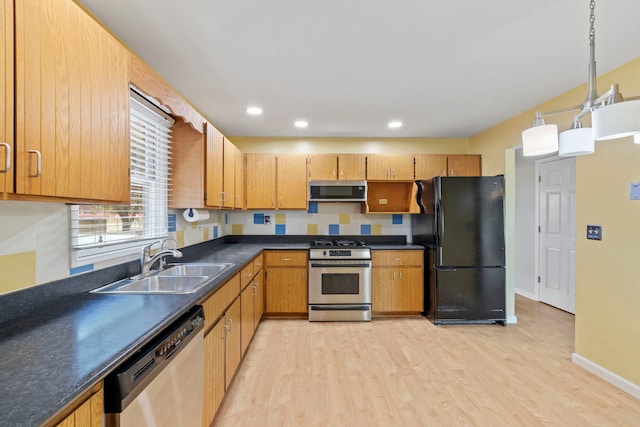 913 S Bentley Rd, New Lenox, IL 60451 - kitchen with stainless steel appliances, light wood finished floors, dark countertops, hanging light fixtures, and recessed lighting