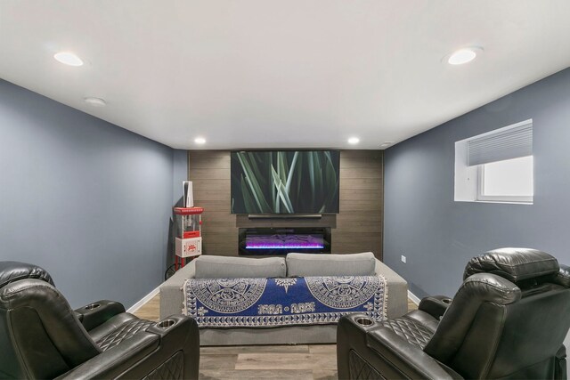 3305 W 66th St, Chicago, IL 60629 - cinema room featuring a glass covered fireplace, recessed lighting, and wood finished floors