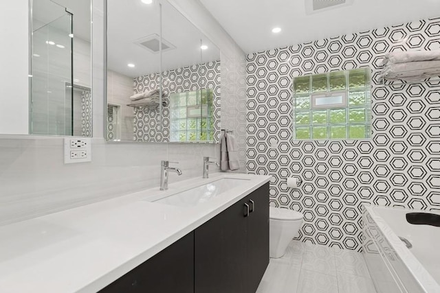 8850 Karlov Ave, Skokie, IL 60076 - bathroom featuring tile walls, vanity, tiled bath, tile patterned floors, and tiled shower